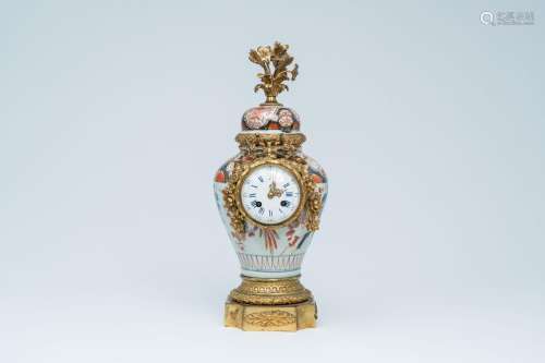 A Japanese Imari vase and cover with gilt bronze clock mount...