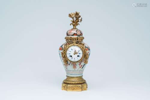 A Japanese Imari vase and cover with gilt bronze clock mount...