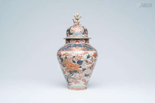 A Japanese Imari vase and cover with floral design and crown...
