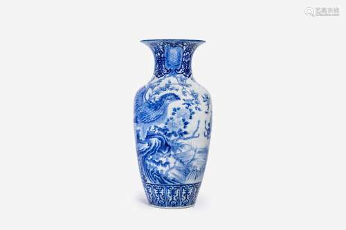 A large Japanese blue and white Arita vase with eagles among...