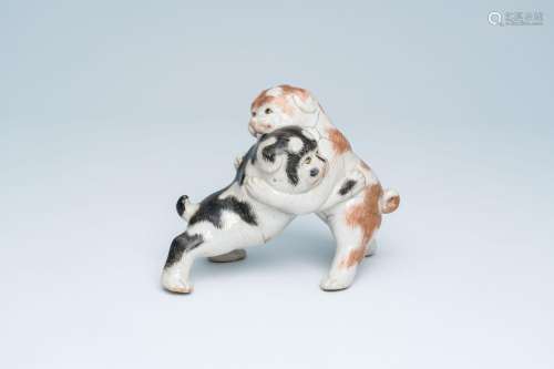 A Japanese polychrome 'playing dogs' group, probably Arita, ...