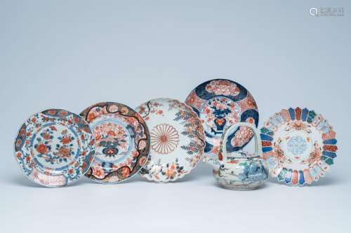 Five Japanese Imari plates with floral design and a sake ewe...