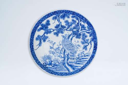 A large Japanese blue and white charger with a bird of prey ...