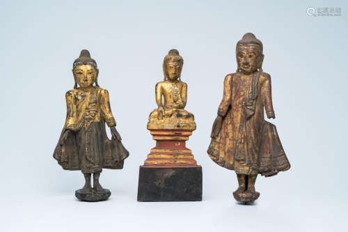 Three partly inlaid gilt wood figures of Buddha, Burma or Th...