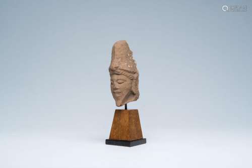 A red sandstone head of a deity, probably Khmer, 13th C.<br ...