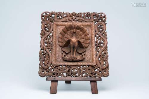 A Nepalese richly carved and open worked wood window panel w...