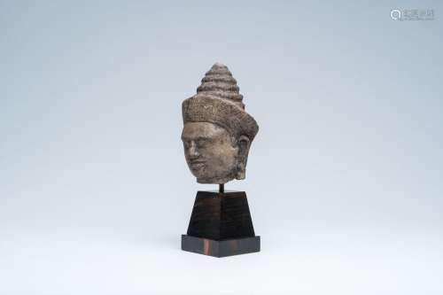 A sandstone head of Vishnu, probably Khmer, 13th C.<br />
H ...