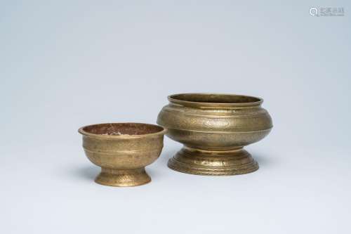 Two Indonesian engraved brass bowls with swastikas and flora...