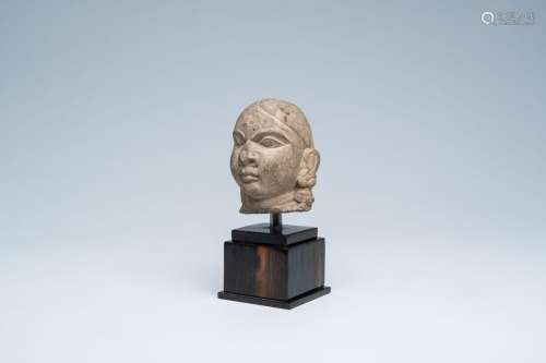A stone sculpture of a deity's head, probably India, 12th/13...