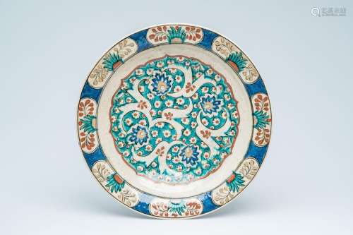A probably French polychrome Iznik style charger with floral...