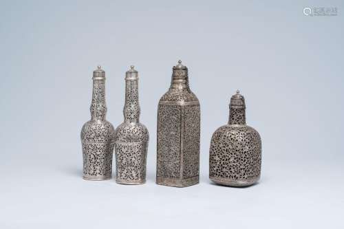 Four reticulated Persian silver and glass decanter flasks, Q...