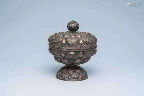 A Persian metal bowl and cover on foot with relief design, I...