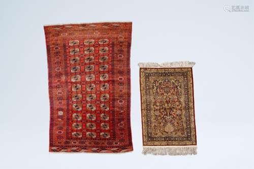 A Turkmen Tekke rug, wool on cotton, and an oriental rug wit...