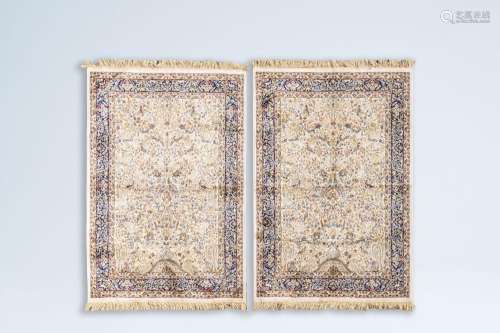 A pair of Iranian Kashmir rugs with birds among blossoming b...