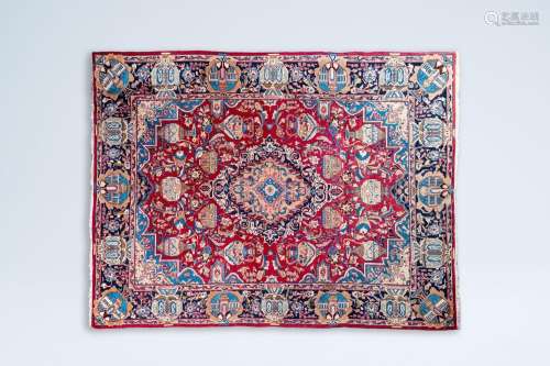 A large Iranian Kashmir rug with antiquities and floral desi...