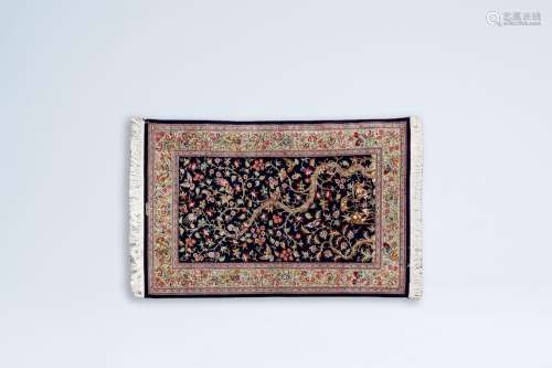 A Persian Qom (Qum/Ghom) rug with deer and birds among bloss...