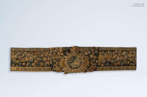 A fragment of a wall tapestry with floral design and a fores...