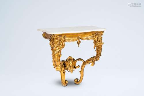 An Italian gilt wood wall console with white marble top, 19t...