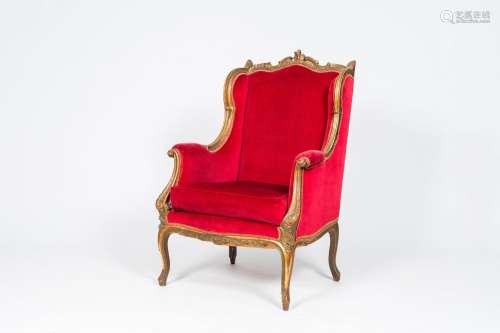 A French Louis XV style red velvet upholstered armchair, 20t...