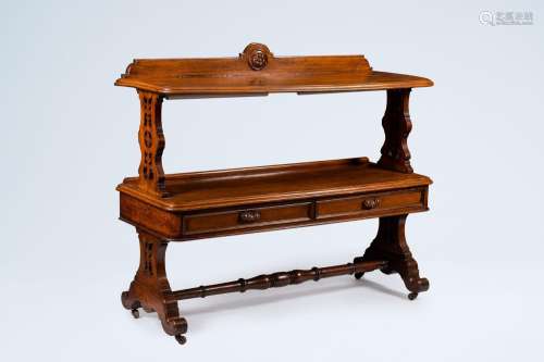 An English oak etagere with open worked sides and two drawer...