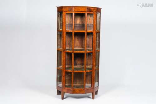 An English octagonal mahogany one-door display cabinet, ca. ...