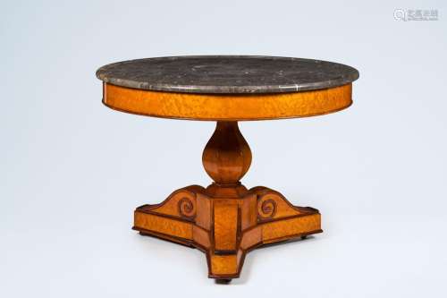 A German burl wood veneered tripod Biedermeier table with ma...