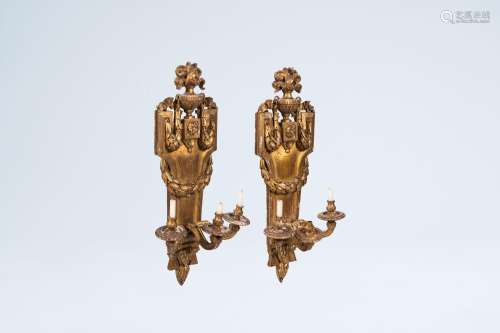 A pair of French Neoclassical gilt wood three-light wall app...