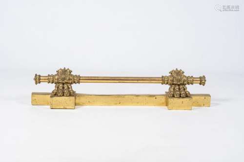 A French gilt brass fire fender with lion paws, 19th C.<br /...