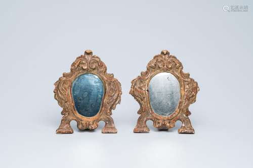 A pair of Italian carved and gilt wood mirrors, 18th C.<br /...