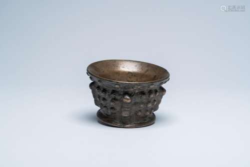 A Spanish patinated bronze mortar with shell relief design, ...