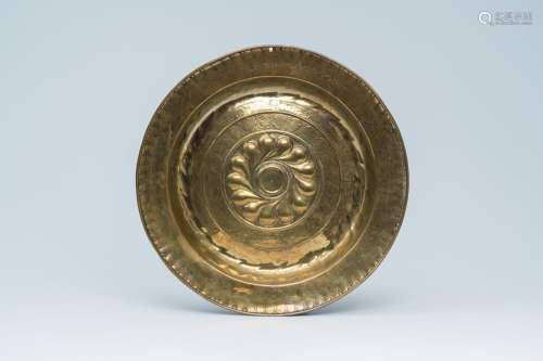 A German brass 'gadroons' alms dish, Nuremberg, 16th/17th C....