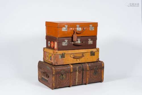 Three various leather travel cases and a steamer trunk with ...