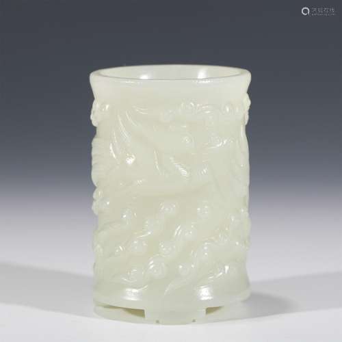 A CHINESE CARVED JADE BRUSH POT