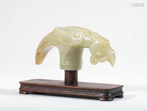 A rare pale green jade carving of a phoenix-form cane handle