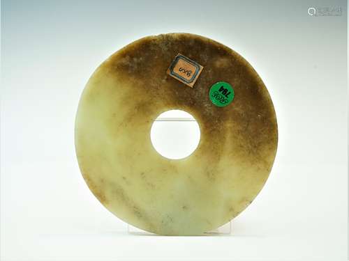 A Chinese Mottled Nephrite Jade Bi Disc, Late Neolithic Peri...