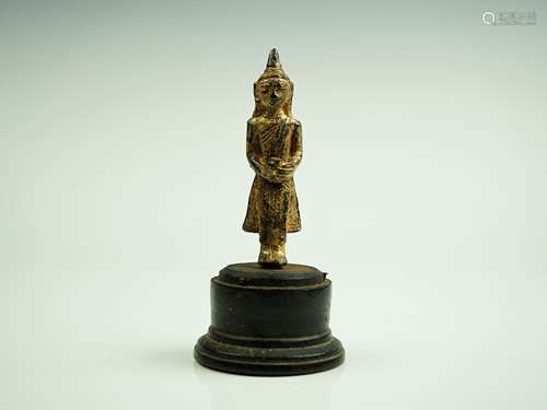 A GILT-BRONZE FIGURE OF BUDDHA