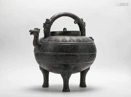 An archaic bronze wine vessel and cover (He), Eastern Zhou d...