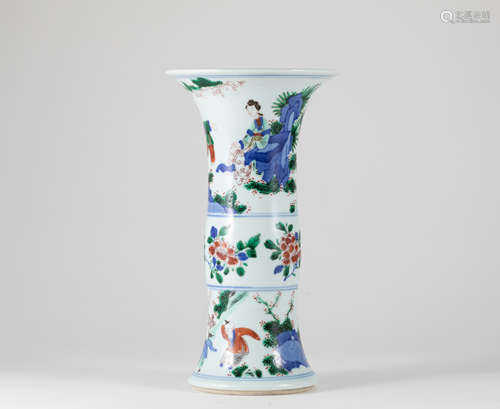 A CHINESE WUCAI 'LADIES AND BOYS' BEAKER VASE, GU