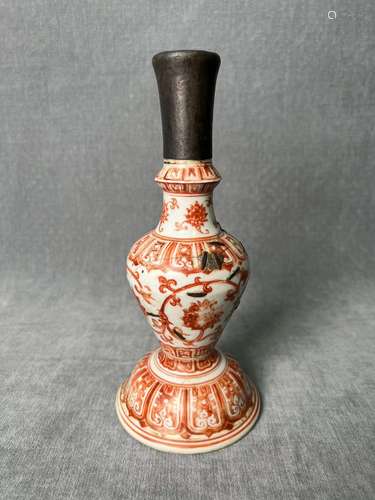 A IRON RED GLAZE FLORAL BUDDHIST VASE