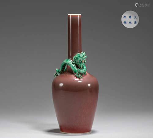 A SANG DE BOEUF-GLAZED BOTTLE VASE WITH TURQUOISE COILED DRA...