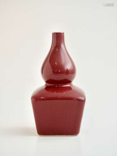 A Chinese monochrome copper-red glazed double-gourd vase, Qi...