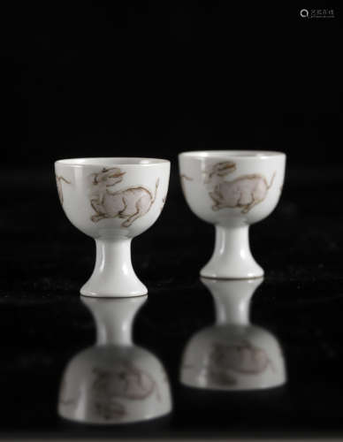 A Chinese copper red 'Animals' stem cups, Yongzheng mark, H ...