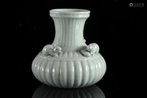 A Chinese celadon glazed 'Mice' ribbed bottle vase, Qianlong...