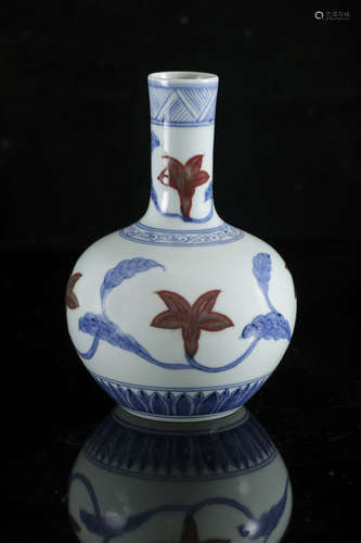 A Chinese copper red and underglaze blue 'Bellflower' bottle...