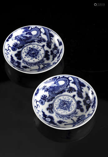 A pair of Chinese blue and white 'Dragon and horse' plates, ...