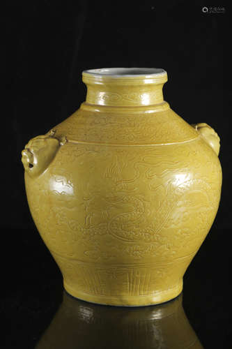 A Chinese early Ming style yellow glazed 'Dragon' carved jar...