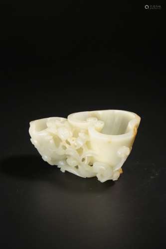 A Chinese russet and white jade carving of a 'lingzhi' washe...