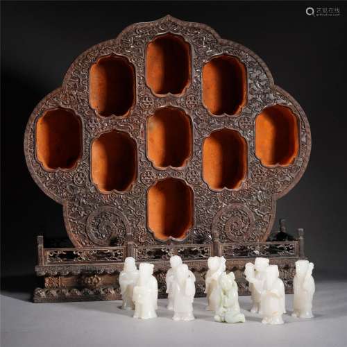 A GROUP OF WHITE JADE CARVED EIGHT IMMORTALS AND ZITAN NICHE...