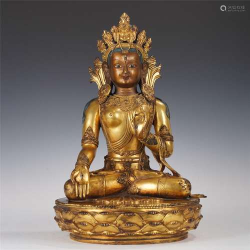 A GILT BRONZE SEATED FIGURE OF TARA