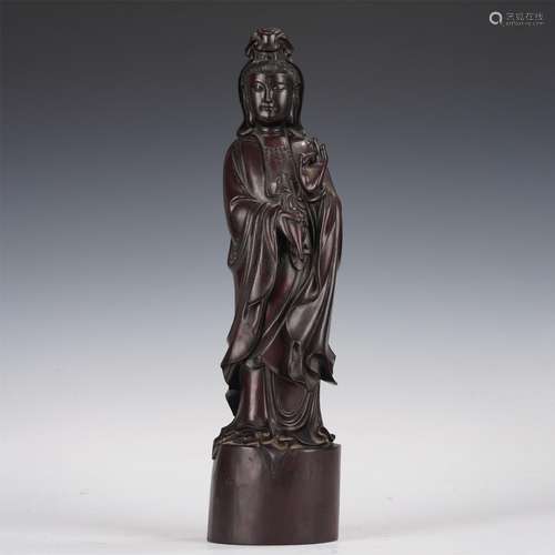 A CARVED ROSEWOOD STANDING FIGURE OF GUANYIN